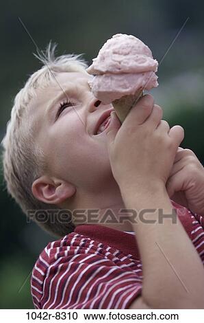 Stock Image - people, eating, ice cream, boy, outdoors, child, blond. Fotosearch