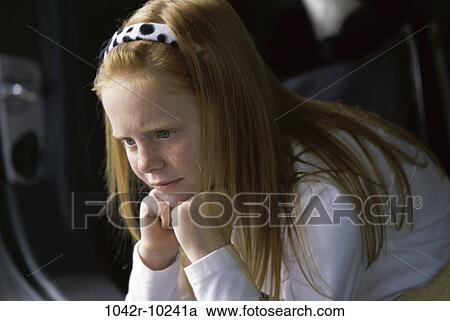 Stock Image - people, girl, serious, child, contemplating, thinking, think. Fotosearch