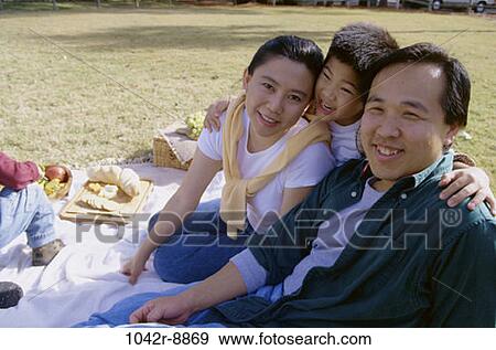 Stock Photo - people, grapes, Asian, fruit, picnic, bread, basket. Fotosearch