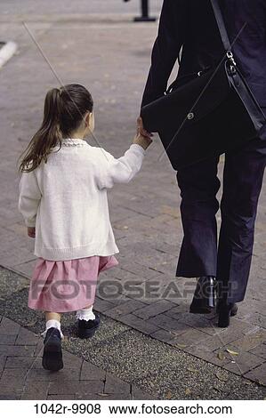 Stock Photo - people, hands, walking, mother, holding, family, sidewalk. Fotosearch