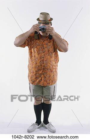 people, hat, Middle-aged, vacations, camera, humor View Large Photo Image Stock Image - people, hat, Middle-aged, vacations, camera, humor. Fotosearch