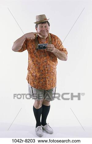 people, hat, Middle-aged, vacations, camera, humor View Large Photo Image Stock Image - people, hat, Middle-aged, vacations, camera, humor. Fotosearch