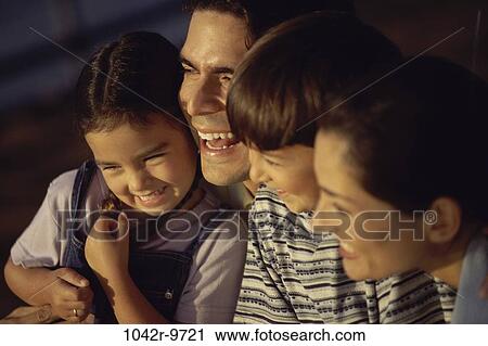 Stock Image - people, Hispanic, outdoors, family, brunette, parents, Caucasian. Fotosearch