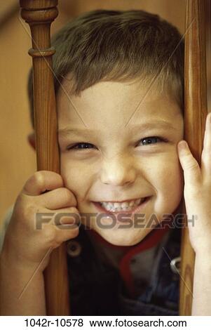 people, laughing, boy, child, bars, headshot View Large Photo Image Stock Photo - people, laughing, boy, child, bars, headshot. Fotosearch