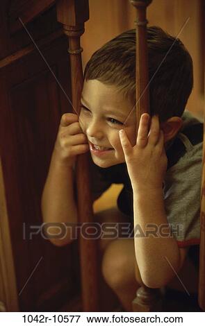 Stock Photo - people, laughing, boy, child, indoors, laugh. Fotosearch
