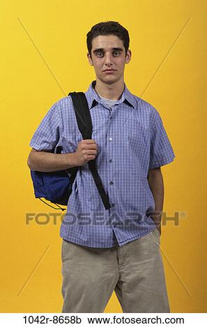 Stock Image - people, male, backpack, carrying, serious, brunette, sullen. Fotosearch