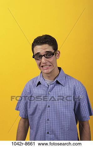 Stock Image - people, male, eyeglasses, stress, brunette, worry. Fotosearch