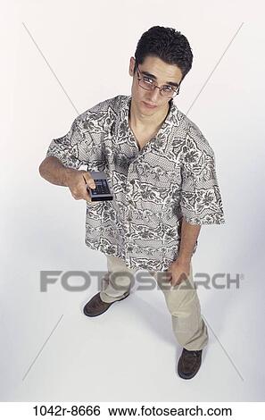 Stock Photograph - people, male, eyeglasses, watch, watching, television, brunette. Fotosearch