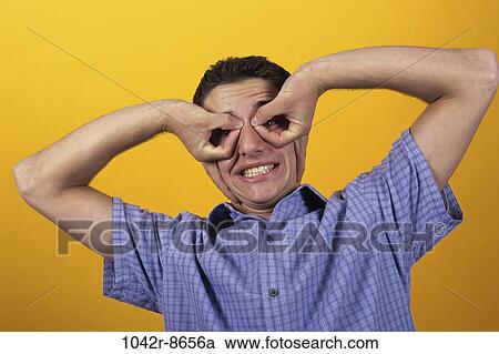 Stock Image - people, male, funny, humor, brunette, indoors. Fotosearch