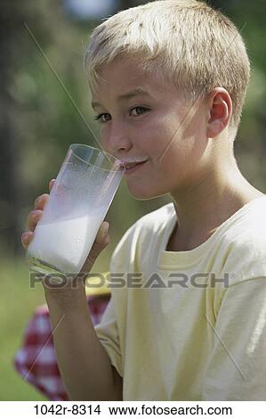 Picture - people, milk, drinking, boy, outdoors, child, blond. Fotosearch