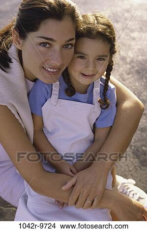 people, mother, Hispanic, outdoors, hugging, family, hug View Large Photo Image Picture - people, mother, Hispanic, outdoors, hugging, family, hug. Fotosearch