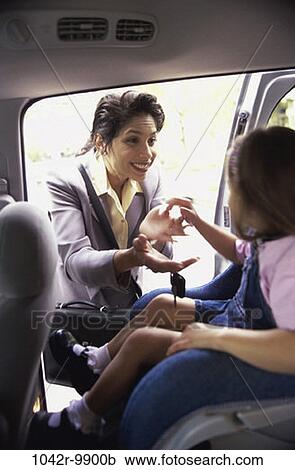 Stock Image - people, mother, Hispanic, outdoors, transportation, family, daughter. Fotosearch