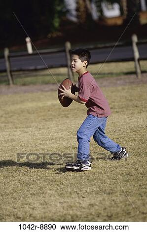 people, playing, Asian, football, catching, boy, outdoors View Large Photo Image Stock Image - people, playing, Asian, football, catching, boy, outdoors. Fotosearch
