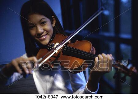 Stock Photo - people, playing, violin, play, indoors, instrument. Fotosearch