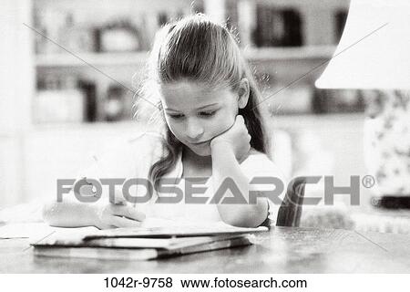Stock Photo - people, reading, book, girl, child, indoors, Caucasian. Fotosearch