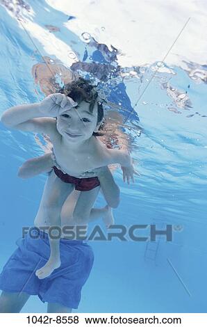 Stock Photo - people, swim, pool, swimming, boy, outdoors, child. Fotosearch