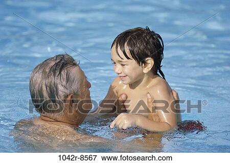 Stock Photo - people, swim, pool, swimming, outdoors, family, grandfather. Fotosearch