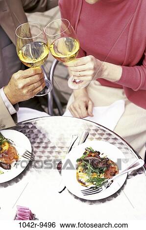 people, table, Asian, couple, toasting, wine, Hispanic View Large Photo Image Stock Photograph - people, table, Asian, couple, toasting, wine, Hispanic. Fotosearch