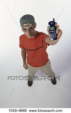 Stock Image - people, telephone, hat, male, eyeglasses, phone, holding. Fotosearch