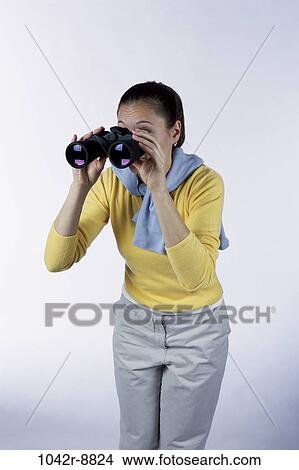 people, woman, binoculars, Hispanic, curious, brunette, indoors View Large Photo Image Picture - people, woman, binoculars, Hispanic, curious, brunette, indoors. Fotosearch