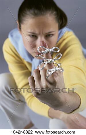 people, woman, Hispanic, metaphors, serious, brunette, string View Large Photo Image Stock Image - people, woman, Hispanic, metaphors, serious, brunette, string. Fotosearch