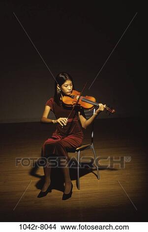 Picture - people, woman, playing, violin, arts, entertainment, play. Fotosearch