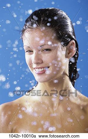 Stock Image - people, woman, shower, brunette, indoors, Caucasian, young adult. Fotosearch