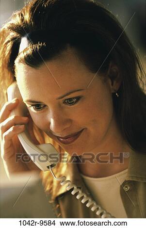 people, woman, telephone, talking, phone, Middle-aged, brunette View Large Photo Image Picture - people, woman, telephone, talking, phone, Middle-aged, brunette. Fotosearch