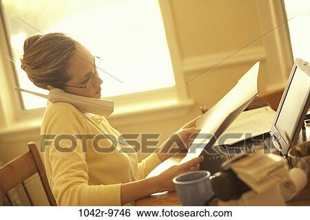 Stock Photograph - people, woman, telephone, talking, eyeglasses, laptop, phone. Fotosearch