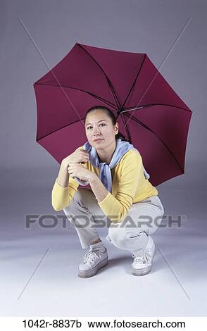 people, woman, umbrella, Asian, open, weather, indoors View Large Photo Image Stock Image - people, woman, umbrella, Asian, open, weather, indoors. Fotosearch