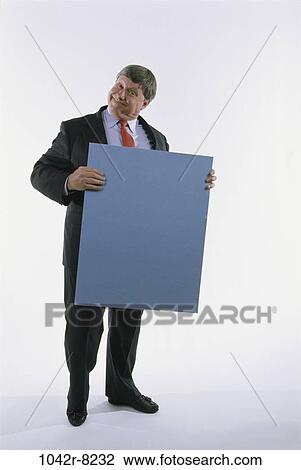 Stock Image - presentation, business, Middle-aged, sign, humor, businessman. Fotosearch