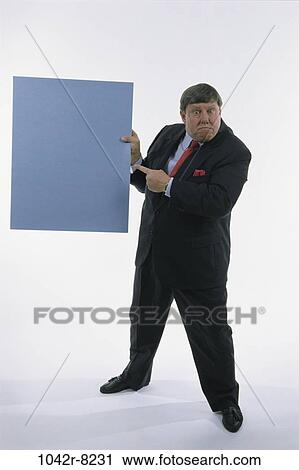 Stock Image - presentation, pointing, business, point, Middle-aged, sign, humor. Fotosearch
