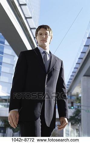 staring, standing, business, outdoors, Middle-aged, serious View Large Photo Image Stock Image - staring, standing, business, outdoors, Middle-aged, serious. Fotosearch