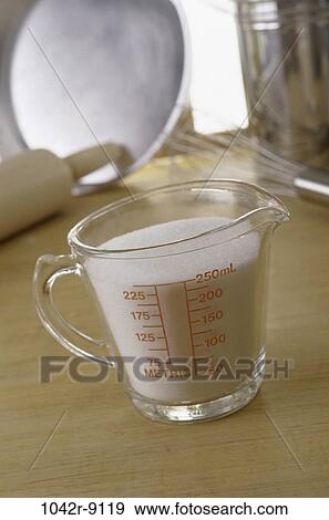 Stock Photo - sugar, equipment, accuracy, food, measure, cup, preparation. Fotosearch