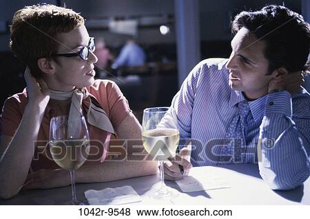 talking, couple, drinking, business, writing, planning, discussing View Large Photo Image Stock Photo - talking, couple, drinking, business, writing, planning, discussing. Fotosearch