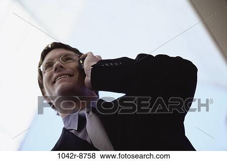 talking, eyeglasses, phone, business, outdoors, Middle-aged View Large Photo Image Stock Photo - talking, eyeglasses, phone, business, outdoors, Middle-aged. Fotosearch