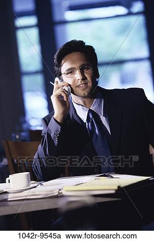 Stock Image - talking, paperwork, coffee, phone, business, restaurant. Fotosearch