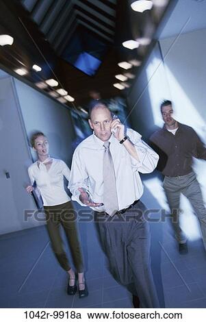 talking, phone, hallway, business, Middle-aged, cell phone, indoors View Large Photo Image Stock Image - talking, phone, hallway, business, Middle-aged, cell phone, indoors. Fotosearch