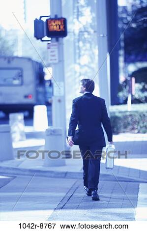 walking, briefcase, crossing, back, street, cross View Large Photo Image Stock Photo - walking, briefcase, crossing, back, street, cross. Fotosearch