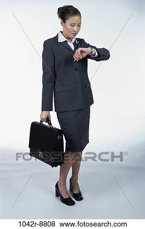woman, briefcase, Hispanic, watch, business, indoors, anticipating View Large Photo Image Stock Photo - woman, briefcase, Hispanic, watch, business, indoors, anticipating. Fotosearch