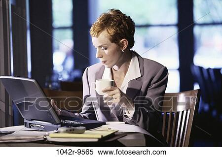 woman, computer, laptop, drinking, business, restaurant, serious View Large Photo Image Stock Photography - woman, computer, laptop, drinking, business, restaurant, serious. Fotosearch