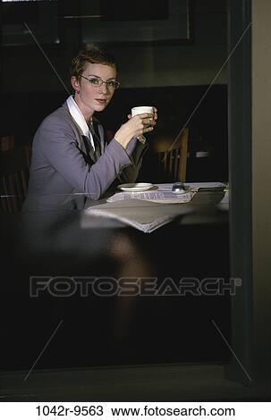 Stock Image - woman, drinking, business, indoors, drink, Caucasian, businesswoman. Fotosearch