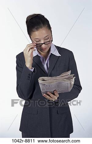woman, newspaper, eyeglasses, Hispanic, reading, business, indoors View Large Photo Image Stock Image - woman, newspaper, eyeglasses, Hispanic, reading, business, indoors. Fotosearch