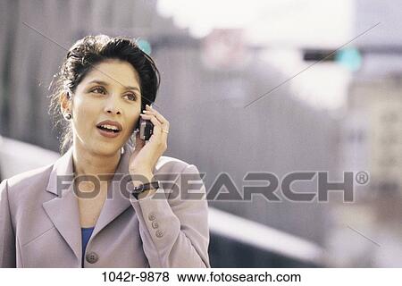 woman, talking, Hispanic, phone, business, outdoors, cell phone View Large Photo Image Stock Photo - woman, talking, Hispanic, phone, business, outdoors, cell phone. Fotosearch