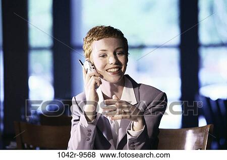Stock Photo - woman, talking, phone, business, restaurant, cell phone, cell. Fotosearch