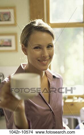 woman, toasting, coffee, mug, coffee cup, holding, blond View Large Photo Image Picture - woman, toasting, coffee, mug, coffee cup, holding, blond. Fotosearch