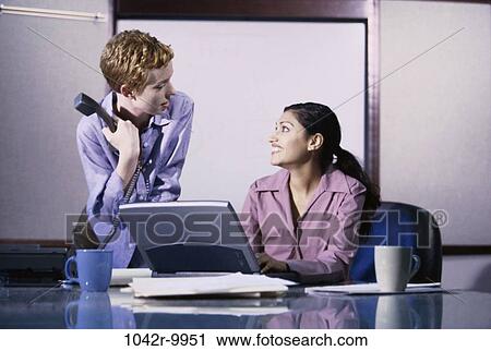 women, talking, computer, laptop, phone, business, using View Large Photo Image Stock Image - women, talking, computer, laptop, phone, business, using. Fotosearch