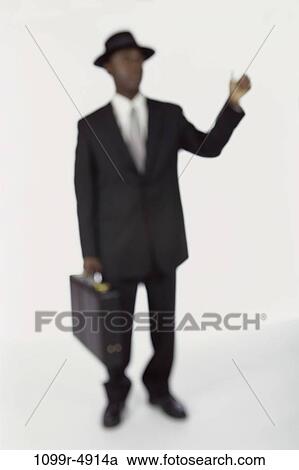 Stock Image - blur, briefcase, silhouette, business, businessman, indoors. Fotosearch