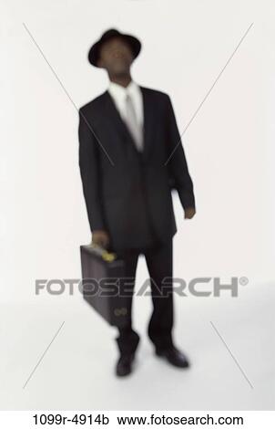 Stock Image - blur, briefcase, silhouette, business, businessman, indoors. Fotosearch