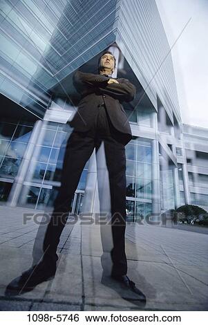Stock Photograph - blur, building, tall, confident, standing, business. Fotosearch